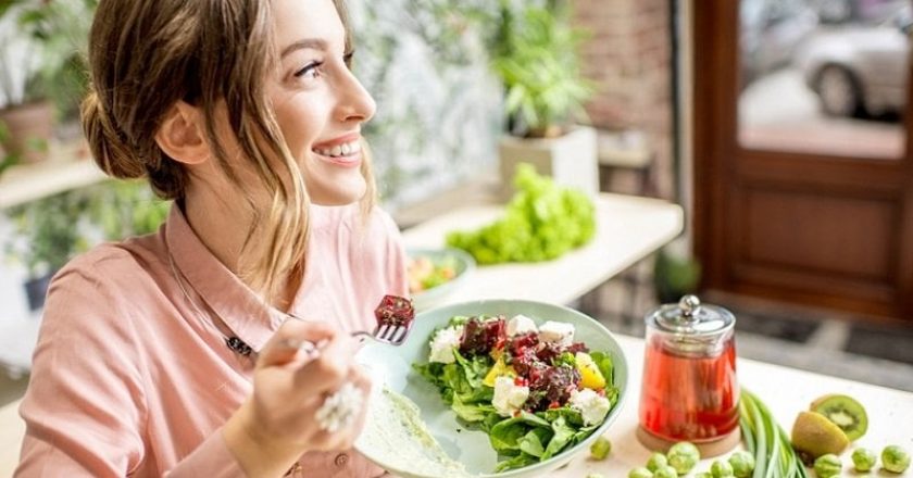 young woman enjoying vegetarian keeto diet